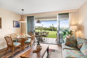 a living room with a couch and a table at Eldorado A108 in Kaanapali