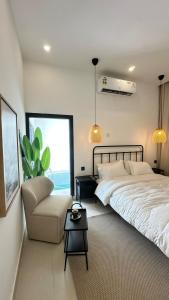 Voodi või voodid majutusasutuse SUN Chalet toas