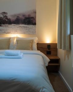 Ένα ή περισσότερα κρεβάτια σε δωμάτιο στο Hotel & Spa Lepo Mesto