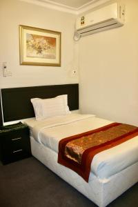 Postel nebo postele na pokoji v ubytování Summer Land Hotel + 9 fotografií