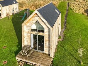 an overhead view of a tiny house with a bench at Bothy 2 - Uk50472 in Greenhaugh