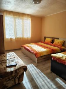 Postel nebo postele na pokoji v ubytování Вила Владислава - стаи за гости