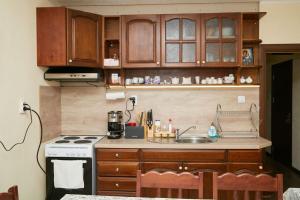 Kuchyň nebo kuchyňský kout v ubytování Вила Владислава - стаи за гости + 23 fotografií