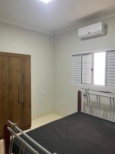 Postel nebo postele na pokoji v ubytování Casa de temporada