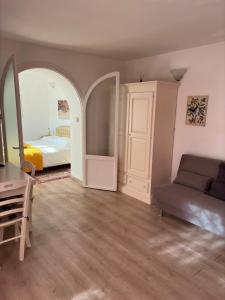 a living room with a bed and a couch at Marilyn's House 2 in Frascati