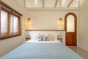 Postel nebo postele na pokoji v ubytování Rock & Lune Boutique Villas