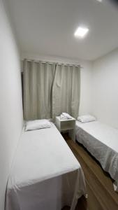 En eller flere senge i et værelse på Casa em Diamantina