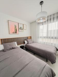 Voodi või voodid majutusasutuse Luxe appartement op de begane grond met een fijne tuin toas