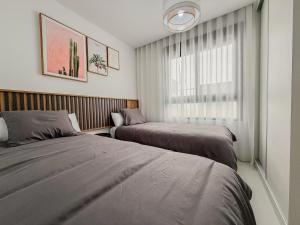 Voodi või voodid majutusasutuse Luxe appartement op de begane grond met een fijne tuin toas +28 fotot