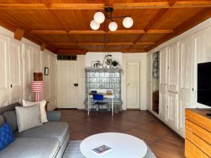 a living room with a couch and a table at Steps To Bern's Best Historic Sites! in Bern