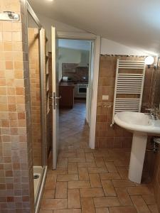 a bathroom with a sink and a toilet in it at Casa Mille Lire in Ciampino