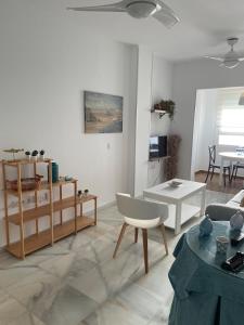 a living room with a couch and a table at La casa del mar in Zahara de los Atunes