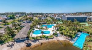 an aerial view of a resort with two pools at Condomínio Ilhas Park Xangri-lá in Xangri-lá