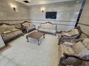 TV a/nebo společenská místnost v ubytování فندق مهوى الفؤاد - المعابدة