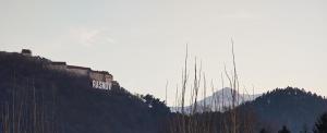 a building on the side of a mountain at Casa Narciselor in Râşnov +25 photos