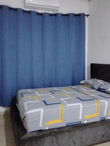 En eller flere senge i et værelse på Roominlapaz