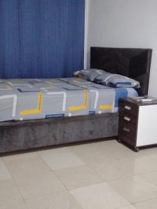 En eller flere senge i et værelse på Roominlapaz