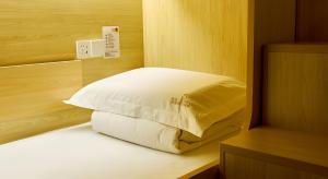 Ένα ή περισσότερα κρεβάτια σε δωμάτιο στο 深度青年旅舍