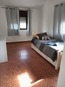 a bedroom with a bed in the middle of it at צימר טיילת הכלנית in Ma'alot Tarshiha