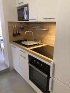 Køkken eller tekøkken på T2 cozy terrasse 40 m2 et pergola