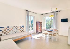 a living room with a couch and a table at Residence Capobianco in Portoferraio