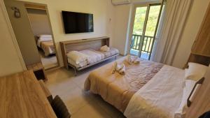 Postel nebo postele na pokoji v ubytování Hotel Tre Monti + 50 fotografií