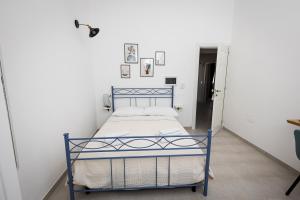 Ένα ή περισσότερα κρεβάτια σε δωμάτιο στο Le Dimore di Nonna Nina