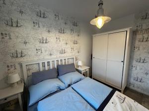 Ένα ή περισσότερα κρεβάτια σε δωμάτιο στο Urlaub für Paare direkt am Meer