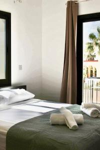 a bedroom with two beds with towels on them at Casa Elea in Kouklia +21 photos