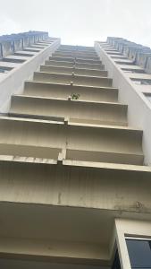 a large white building with stairs on the side of it at Apartamento aconchegante in Belém +9 photos