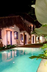 Bazén v ubytování Pousada Villa Encantos do Mar nebo v jeho okolí