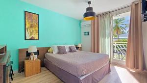 Postel nebo postele na pokoji v ubytování Ti-Colibris