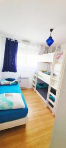 Postel nebo postele na pokoji v ubytování Apt Disneyland 2 chambres, parking, bus sur place