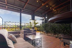 a living room with a couch and a table at Riverside Suites Buwate in Kampala
