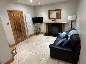 Μια τηλεόραση ή/και κέντρο ψυχαγωγίας στο 6 bed house, 4 bath house in Brickens