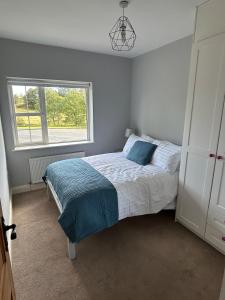 Ένα ή περισσότερα κρεβάτια σε δωμάτιο στο 6 bed house, 4 bath house in Brickens