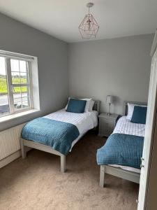 Ένα ή περισσότερα κρεβάτια σε δωμάτιο στο 6 bed house, 4 bath house in Brickens +12 φωτογραφίες