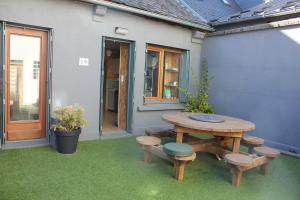 Κήπος έξω από το Chouette Bourboule 2 chambres, 6 pers, terrasse