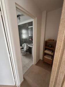 a bathroom with a toilet and a sink at urbano in Neuquén