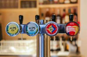 a bunch of different stickers on a metal pole at Mustard Hostel in Dijon +20 photos