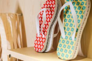 a shelf with three ties sitting on a chair at Mustard Hostel in Dijon