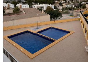 Bazén v ubytování Bonito Apartamento en Moraira a 5 min de la Playa nebo v jeho okolí