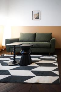 a living room with a couch and a table at bel appartement 2-4 personnes coeur de ville Angers in Angers