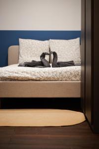 a bed with two pairs of shoes on it at bel appartement 2-4 personnes coeur de ville Angers in Angers