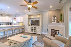 a living room with a table and a fireplace at Stairway to Havens - North in Myrtle Beach