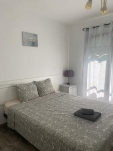 Postel nebo postele na pokoji v ubytování Apartments Tazacorte Beach 2-3 floor