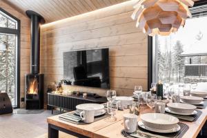 TV a/nebo společenská místnost v ubytování LeviLakeVillas B