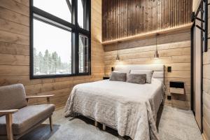 Postel nebo postele na pokoji v ubytování LeviLakeVillas B