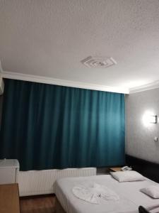 Postel nebo postele na pokoji v ubytování Prenses Otel