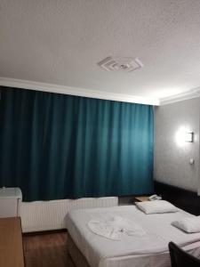 Postel nebo postele na pokoji v ubytování Prenses Otel